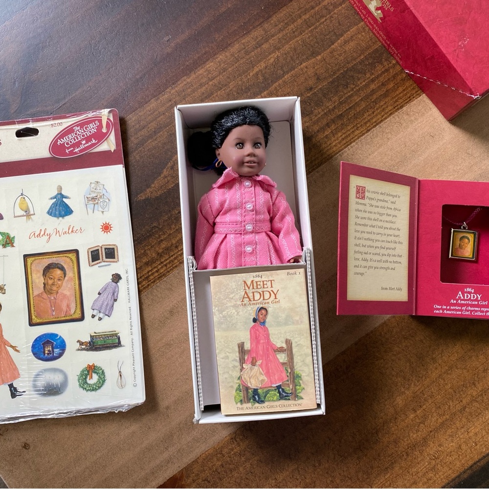 American Girl Addy doll, charm in box and stickers